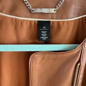 Brown leather cropped jacket.
